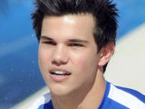Taylor Lautner and Marlon Wayans participating in the fourth annual DIRECTV Celebrity Beach Bowl Tournament held on Miami Beach, Florida