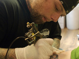 A tattoo artist