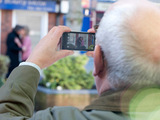 Convinced they're having an affair, Norris takes a picture of Lewis and Audrey together.