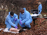 Crime Scene Examiner Eddie Olosunje and D.S. Stevie Moss are at the body of the young boy. 