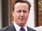 Prime Minister David Cameron leaving his house