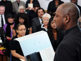 Lucas looks strained as he addresses the congregation.