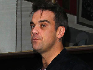 Robbie Williams leaves the BBC Radio 1 studios in London
