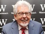 Rolf Harris at a signing for his new book 'A Life in Art' at a Waterstones store in Bluewater, Kent