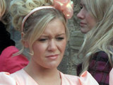 A jealous Eve looks on outside the wedding