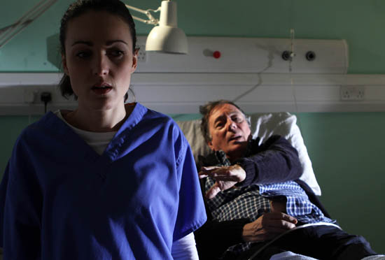 Silas Blissett (Jeff Rawle) has a heart attack and needs help from Lynsey Nolan (Karen Hassen).
