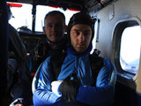 Aaron and Hzael look on as Jackson does a sky dive