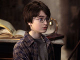 A young Daniel Radcliffe picks up his wand in Harry Potter and the Philosopher's Stone