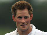 A muddy Prince Harry after a charity match of Polo, England
