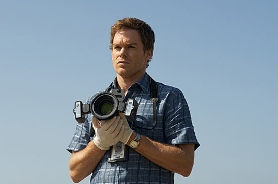 Dexter holds a camera