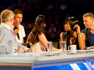 George gets up and close and personal with the panel