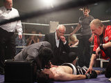 Eddie and Anthony look on whilst Tyler receives treatment