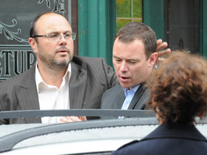 Frank is lead to a police car after being re-arrested