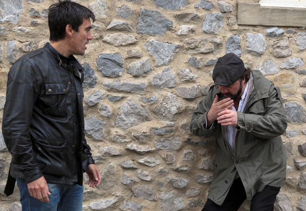 Cain Dingle (Jeff Hordley) punches Zak Dingle (Steve Halliwell) while Lisa Dingle (Jane Cox) watches on
