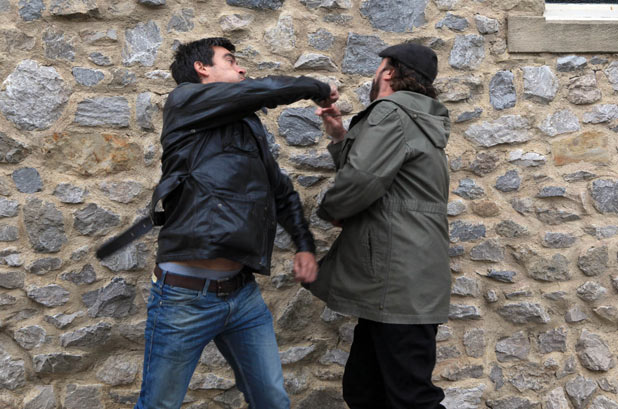 Cain lashes out and punches Zak