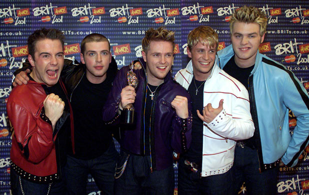 Westlife pose for photographers with their award for the Best Pop Act during The Brit Awards 2001