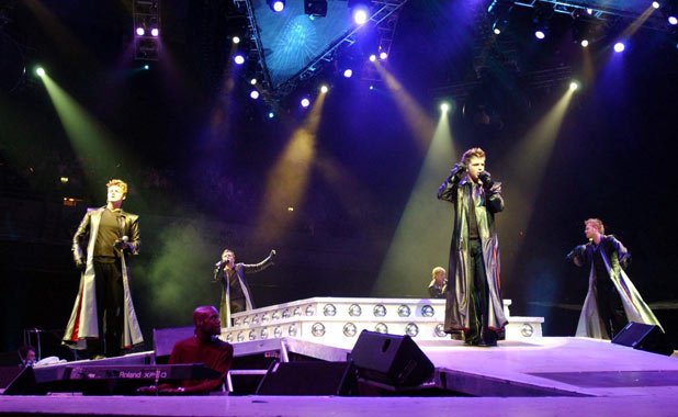 Westlife perform on stage at Earls Court