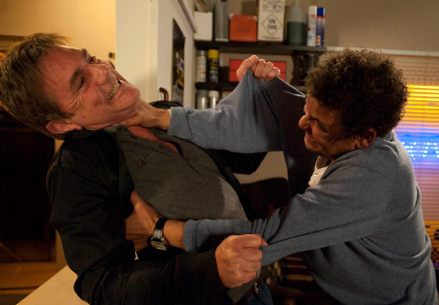 Lloyd pins Karl up against the wall after he insults Cheryl