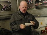 Phil is perplexed by the identity of the person in the picture
