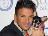 Peter Andre cuddles a canine pal at the Battersea Dogs & Cats Home Collars and Coats Ball