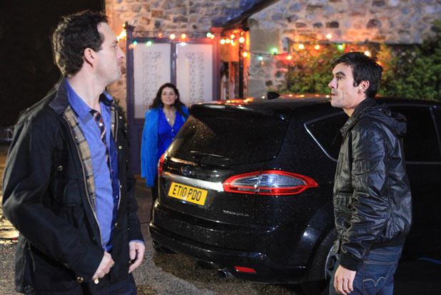 A furious John follows Cain out the pub to Moira's horror