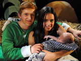 Chesney and Katy hold the new born baby