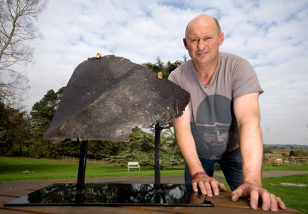 Nigel 'Spud' Ely founder of Trebletap War Relic Art, and former 22nd Special Air Service soldier, with the left buttock of the Saddam Hussein statue