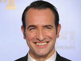 Actor Jean Dujardin poses backstage with the award for Best Motion Picture - Comedy or Musical for the film "The Artist"