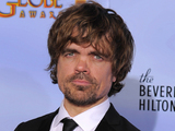 Actor Peter Dinklage poses backstage with the award for Best Supporting Actor in a Series, Mini Series or TV Movie for "Game of Thrones"