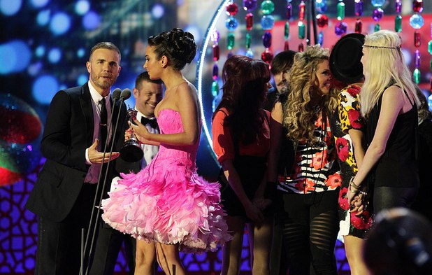 Gary Barlow and Tulisa Contostavlos collect the Best Talent Show award for X Factor on stage during the 2012 NTA Awards
