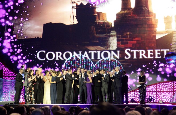 Cast and crew of Coronation Street collect the Serial Drama award on stage during the 2012 NTA Awards