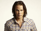 Taylor Kitsch as Tim Riggins in Friday Night Lights