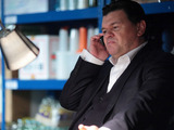 Derek makes a call to his hitman.