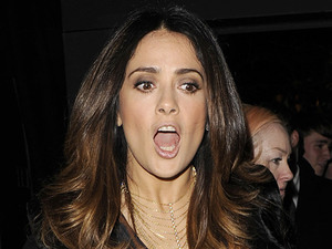 Salma Hayek gets her shoe stuck in a metal grid and nearly falls in London