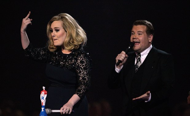 Adele sticks her middle finger up after being cut off at the Brits 2012