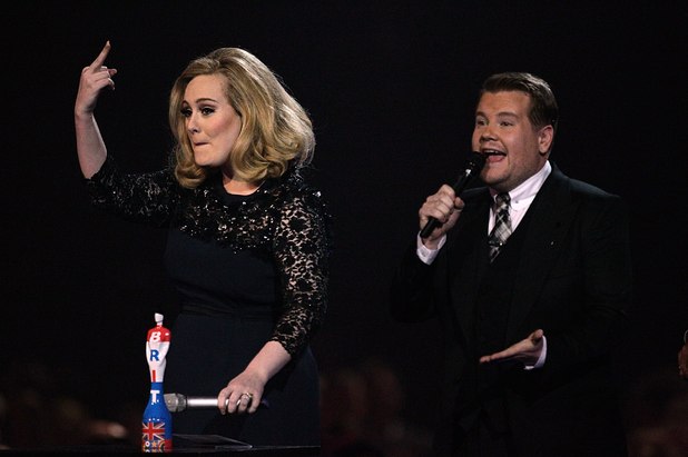 Adele sticks her middle finger up after being cut off at the Brits 2012