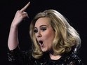 Adele sticks her middle finger up after being cut off at the Brits 2012