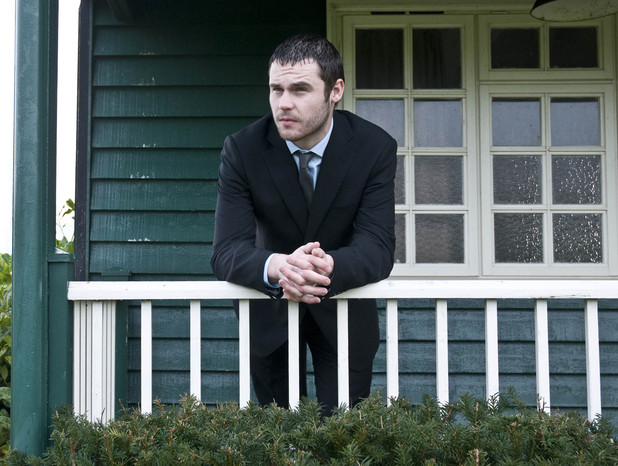 Aaron waits at the cricket pavilion in his suit, as he thinks about the day ahead and his impending court case