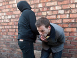 Doug's attacker takes the parcel he was delivering for Brendan.
