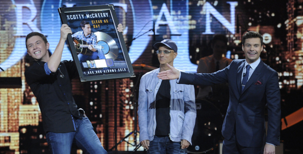 Scotty McCreary is presented with a platinum record for 'Clear As Day'