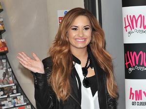 Demi Lovato
signs copies of her new album 'Unbroken' at HMV Oxford Circus.
London