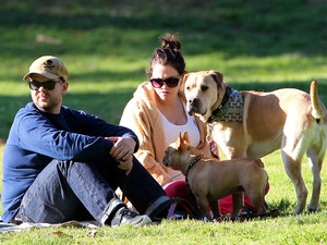 Jack Osbourne and his pregnant fiancee Lisa Stelly chill out on a blanket in the park with their dogs
Los Angeles, California