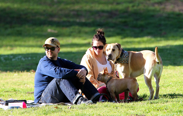 Jack Osbourne and his pregnant fiancee Lisa Stelly chill out on a blanket in the park with their dogs
Los Angeles, California