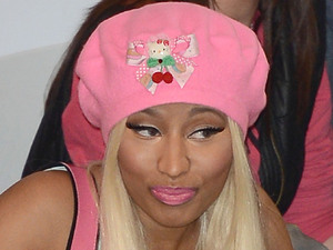Nicki Minaj signs copies of her new album 'Pink Friday: Roman Reloaded' at HMV.