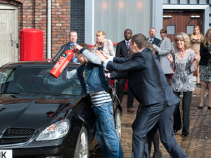 Everyone looks on as David smashes Nick's car up