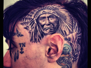Trace Cyrus
posted this image on Twitter with the caption ''Got my head tatted today! Excuse all the ink on my face. And yes this hurt!!!'
