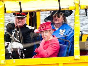Her Majesty The Queen and His Royal Highness The Duke of Edinburgh board the Yellow Duckmarine at Liverpool's Albert Dock