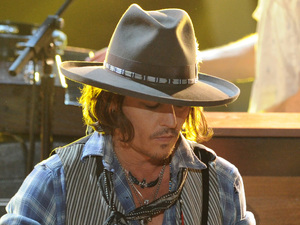 Johnny Depp plays guitar at the MTV Movie Awards 2012