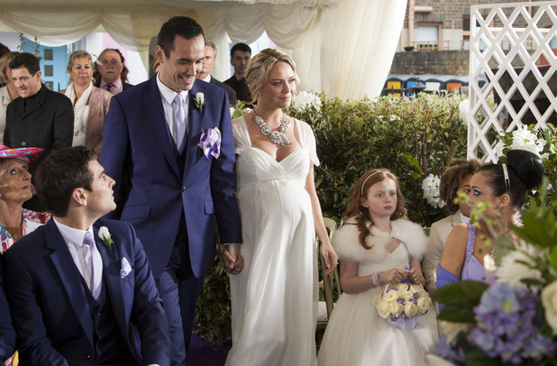 Michael and Janine make their way down the aisle.