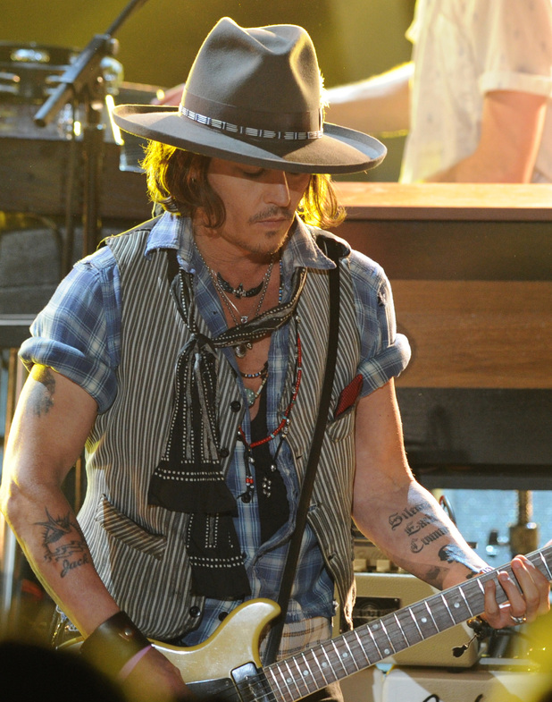 Johnny Depp plays guitar at the MTV Movie Awards 2012